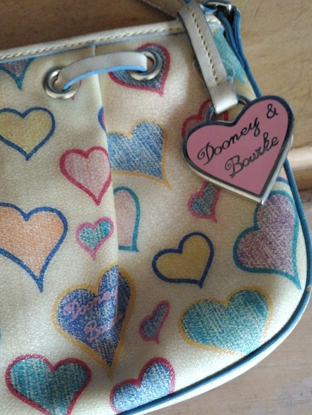 Dooney & Bourke Cream Shoulder Bag with Multicolor Heart Print